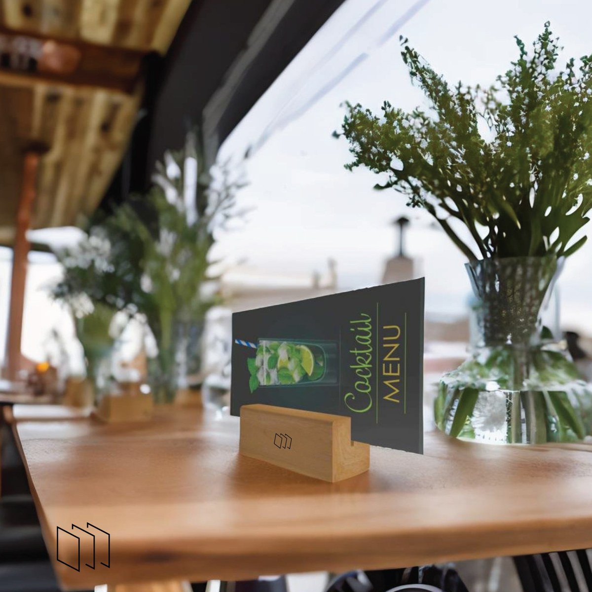 Wooden tabletop holder displaying an English cocktail menu